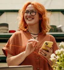 Woman using phone to pay utility bill