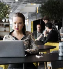 Woman working on laptop teaser