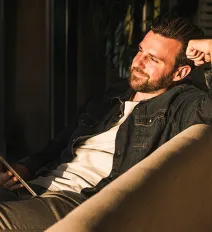 Man sitting in a chair smiling