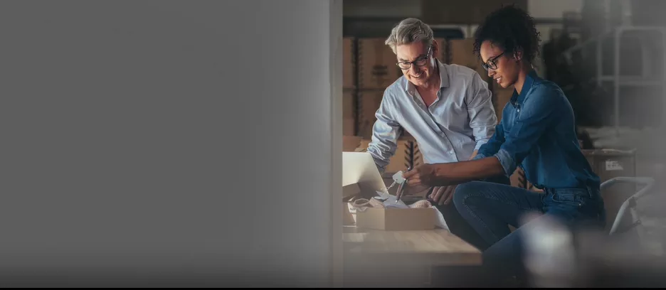 image of woman and man opening box 