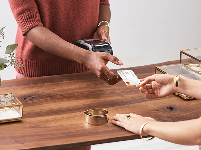 Someone using contactless payment teaser