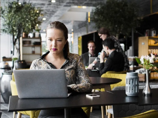 Woman working on laptop teaser