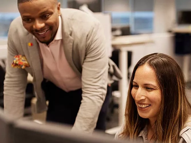 People collaborating on a computer teaser