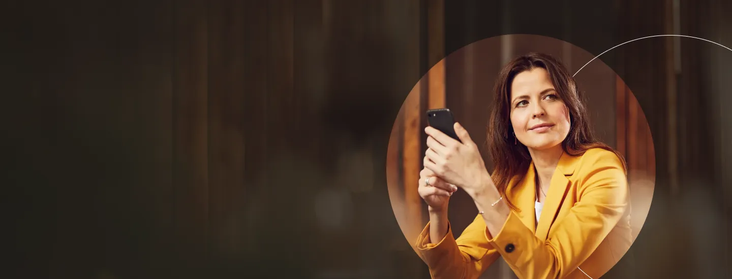 Woman in yellow blazer on cell phone