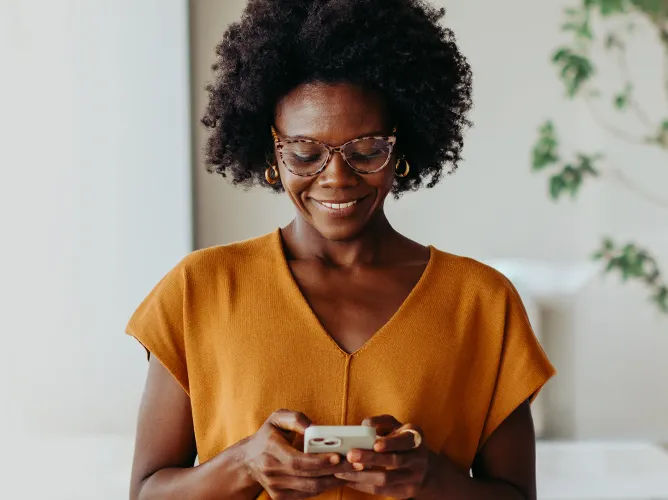 Woman looking at her phone in her hands