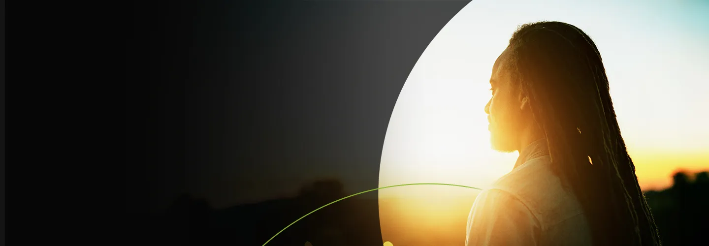 Woman looking into the sun banner