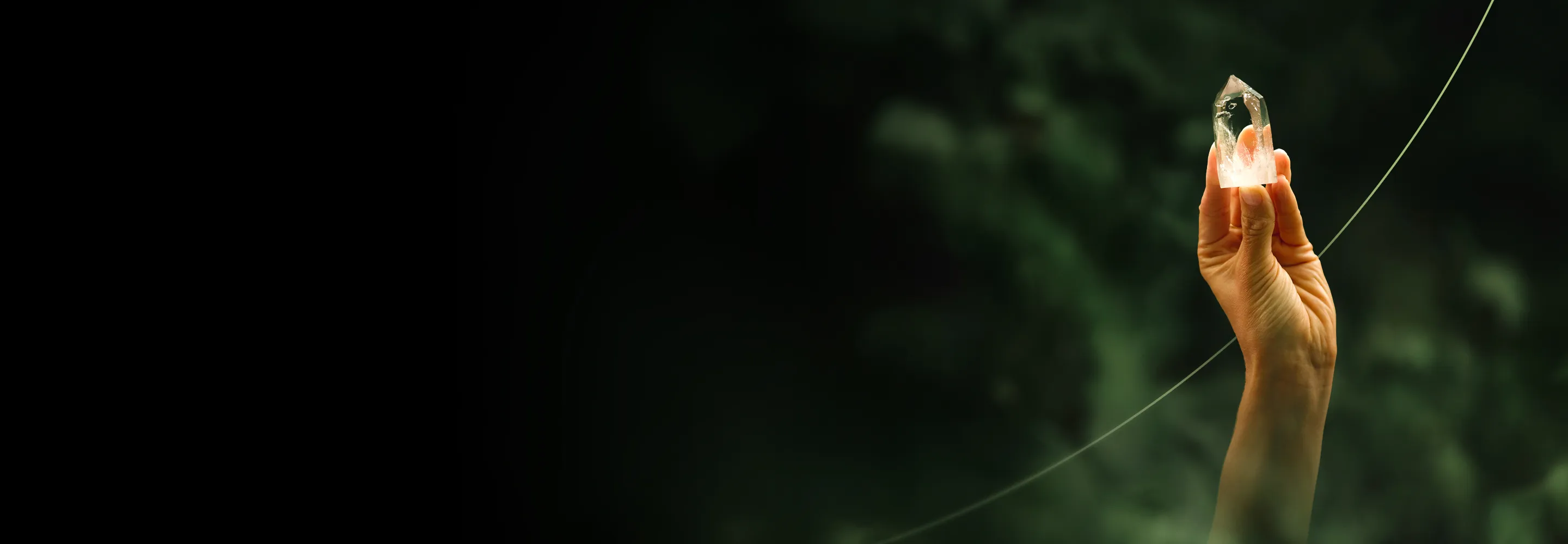 Hand holding crystal