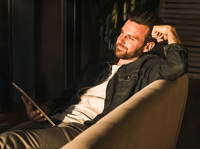 Man sitting in a chair smiling
