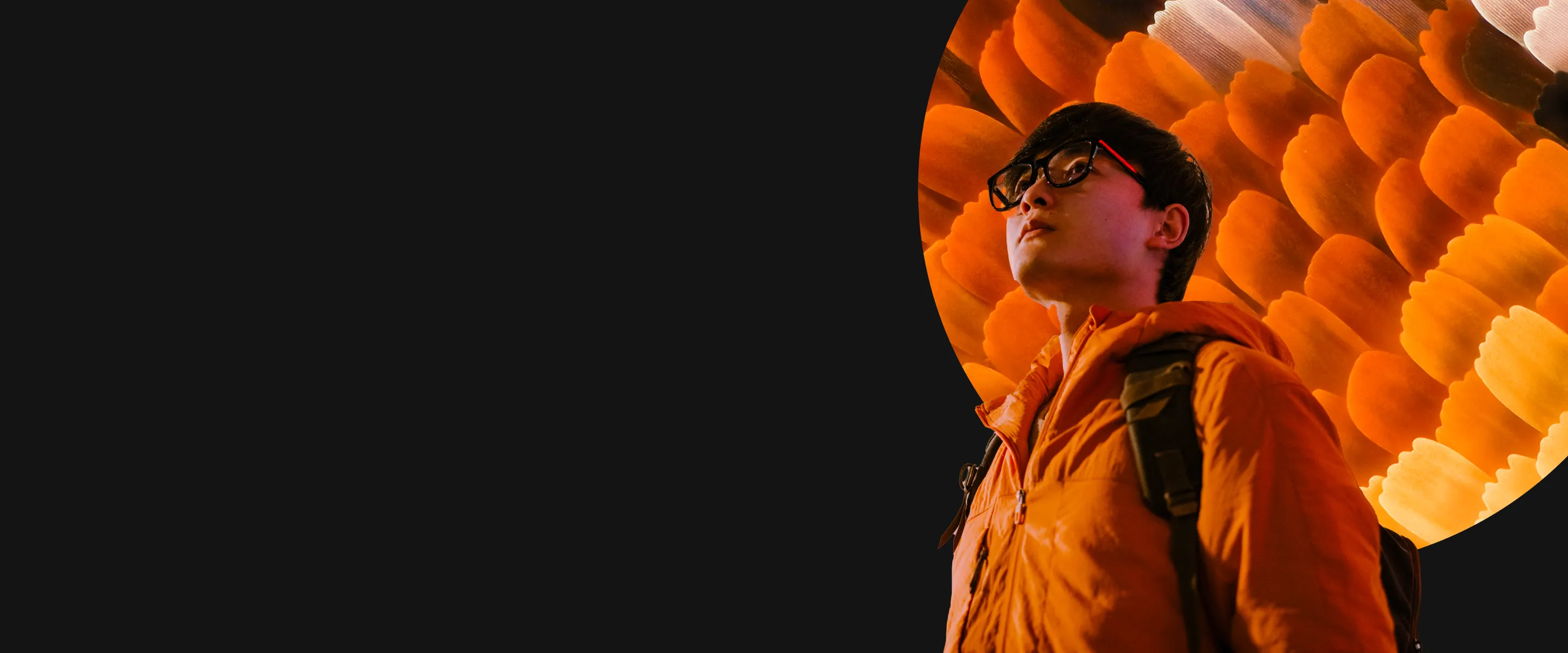 Man standing in front of orange background